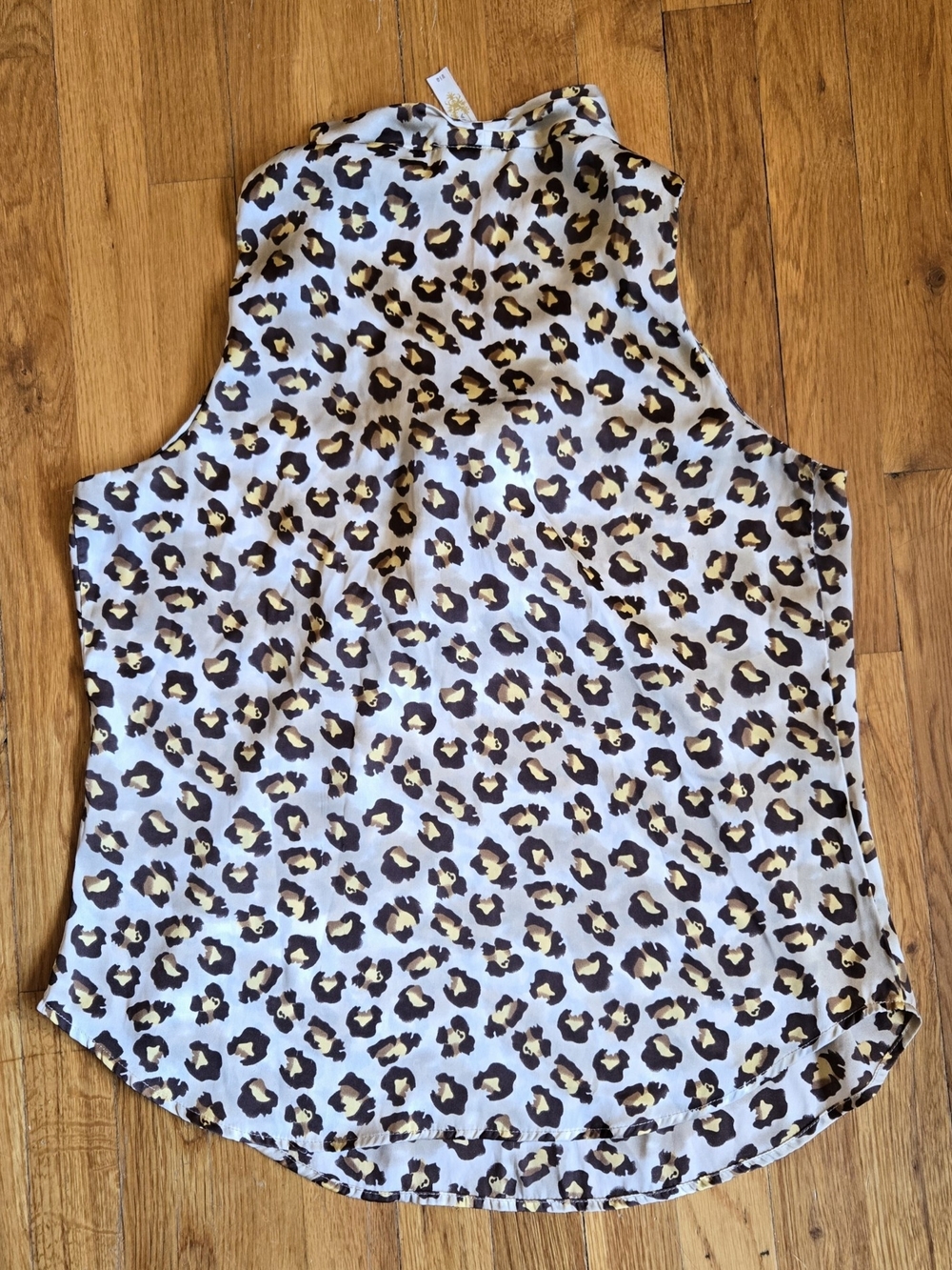 A Diva Leopard Print Sleeveless Halter Satin Top Featuring a Tie Neckline Size L